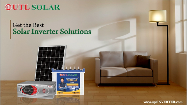 An advertisement for UTL Solar, displaying a solar panel, a solar inverter, and a tubular battery in a living room setup with a sofa and floor lamp. Text reads "Get the Best Solar Inverter Solutions" with the website "www.upsINVERTER.com" at the bottom.