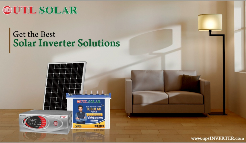 An advertisement for UTL Solar, displaying a solar panel, a solar inverter, and a tubular battery in a living room setup with a sofa and floor lamp. Text reads "Get the Best Solar Inverter Solutions" with the website "www.upsINVERTER.com" at the bottom.